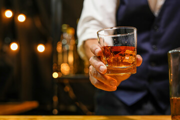 Bartender pouring Whiskey, on  bar,
