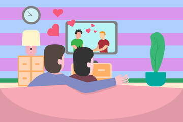 Gay couple watching movie together at home