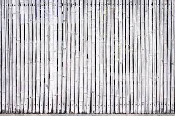 Old bamboo wood fence texture with seamless vertical patterns light white grey background and space