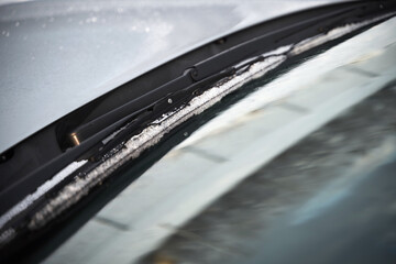 windshield wipers covered with snow