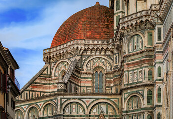 Fototapeta premium Ornate marble facade of the famous Duomo Cathedral in Florence, Italy