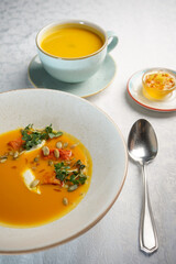 pumpkin soup in a white bowl