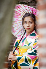 Young girl in Kimono and umbrella