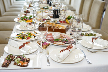 a large table set with dishes in a restaurant macro
