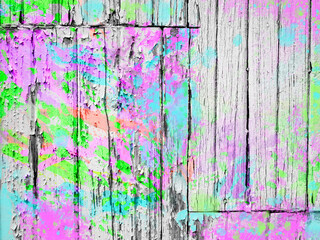 Authentic old worn white peeling painted wall boards with colorful splashes of bright paint in spring colors of pink, purple, neon green, aqua blue and orange. Paint splatter textured background.