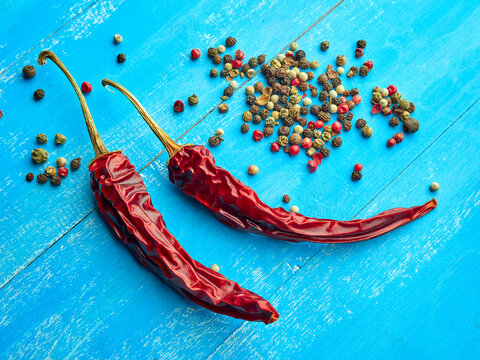 Dry hot pepper on a blue background