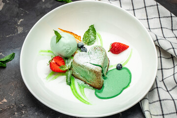 pistachio fondant dessert on a dark background, banner, menu, recipe place for text, top view