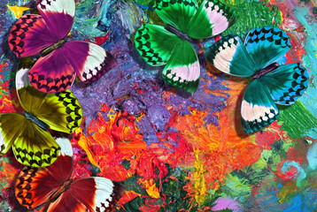 colors of rainbow. colorful tropical morpho butterflies on an artist's palette with strokes of oil...
