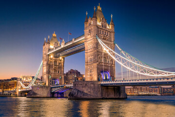 Fototapeta na wymiar London, England; January 21, 2023 - Tower Bridge illuminated at dusk, London, England.