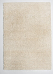 An off-white rectangular carpet that is widely used in America.