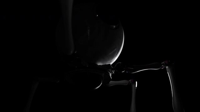 The Robot is walking in Dark, High-tech vide. Cyber spider with a lens - Video for presentation or ads about Hi-tech, Cinematic shot.