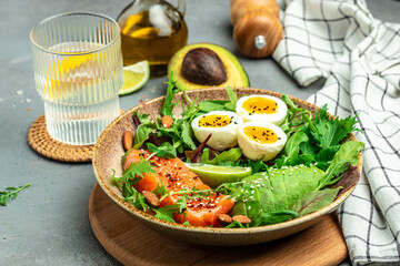 Salmon fillet with fresh salad, grape, eggs and avocado. set of healthy food for keto diet