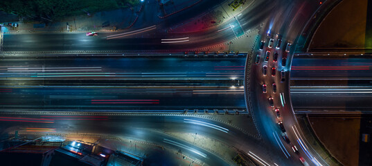 expressway car traffic transportation above circle roundabout road in Asian city. Drone aerial view fly in circle, high angle. Public transport or commuter city life concept	 - obrazy, fototapety, plakaty