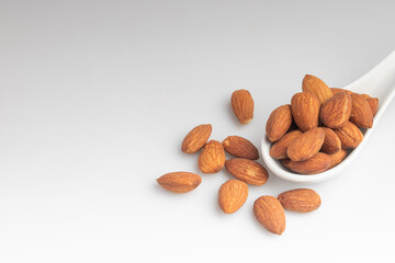 Salted almonds in a white cup.Copy space.