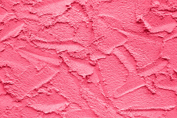 Abstract drawing on plastered wall. Toned Viva Magenta, background, texture. Copy space. Selective focus.