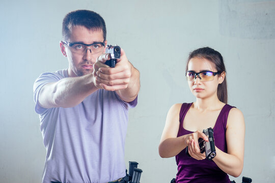 A woman target practicing with a handgun for self defense