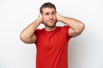 Young caucasian man isolated on white background frustrated and covering ears