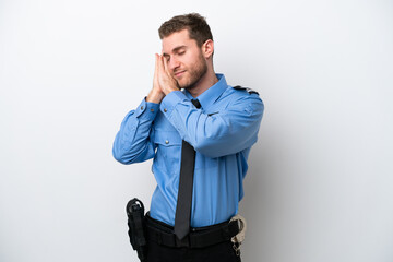 Young police caucasian man isolated on white background making sleep gesture in dorable expression