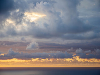 Fototapeta na wymiar Sunset over Tasman sea at Piha beach, Auckland, New Zealand