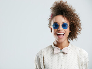 Sunglasses, smile and face of woman on a white background for summer, casual and trendy fashion...