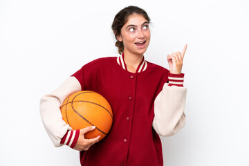 Young basketball player woman isolated on white background pointing up a great idea