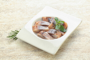 Delicous sliced herring fillet in grape sauce