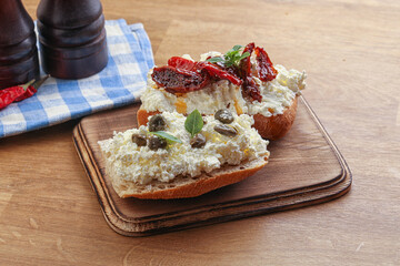 bruschetta with soft cheese capers and tomato