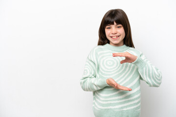 Little caucasian girl isolated on white background holding copyspace imaginary on the palm to...