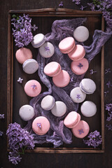 Lovely and homemade lilac flavored macaroons. Summer dessert composition.