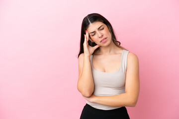Young Italian woman isolated on pink background with headache
