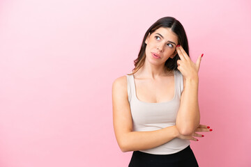 Young Italian woman isolated on pink background with problems making suicide gesture