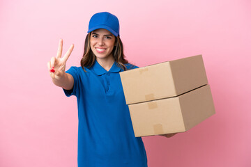 Delivery Italian woman isolated on pink background smiling and showing victory sign