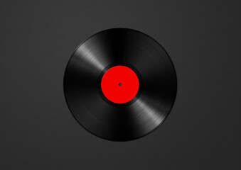 Red vinyl record isolated on black background