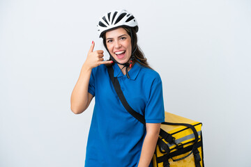 Young delivery woman with thermal backpack isolated on white background making phone gesture. Call me back sign