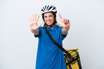 Young delivery woman with thermal backpack isolated on white background counting seven with fingers