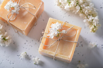 Fototapeta na wymiar Handmade lilac soap made of flowers. Flower aromatic soap.
