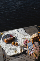 Picnic by the lake during autumn with vibrant foliage and a serene atmosphere