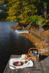 Picnic by the lake during autumn with vibrant foliage and a serene atmosphere