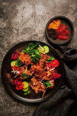 Baked veal liver with kataifi and onion