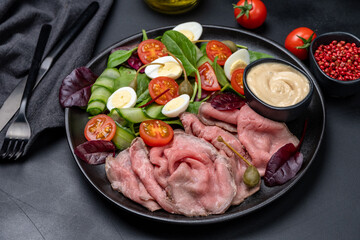 Lunch dish Roast beef with spinach salad and quail eggs healthy lunch keto diet food	