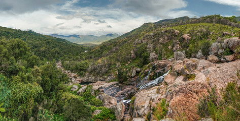Fototapeta na wymiar Panorama of small waterfalls on the mountain river seen during trek to Pic Boby - Madagascar highest accessible peak, in Andringitra national park