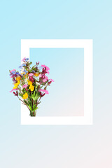 Wildflower posy with white frame on gradient blue background. Minimal abstract border Spring floral  nature composition for Valentines Day, Mothers Day, Easter, birthday. Copy space.