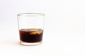 Glass with a drink on a white background.