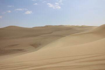 Fototapeta na wymiar Sand dunes in Huacachina, Peru