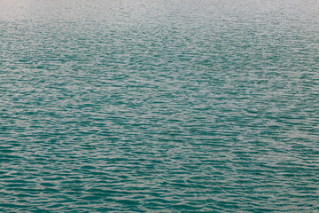 Close up of blue water with calm ripples, austrian lake, nature concept.