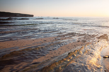 Sunlight on Rocks and Sand at Amoreira Beach; Algarve; Portugal