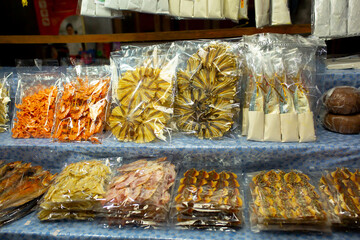 Dried fish and seafood on the market in Thailand. Delicious delicacies of sea fishing.