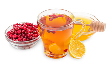 Homemade herbal vitamin hot tea mixed with red cranberries, sliced sour lemon citrus and sweet honey served in transparent glass cup with ingredients isolated on white background made as healthy drink