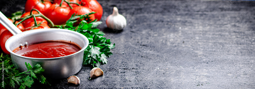 Poster Tomato sauce in a sauce roll with parsley. 