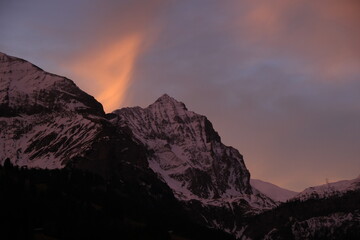 Fototapeta na wymiar Bright lit cloud over Mount Arprlistock, Switzerland.